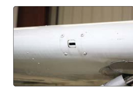A reed-type stall warning device is located behind this opening in the leading edge of the wing. When the angle of attack increases to near the point of a stall, low-pressure air flowing over the opening causes a suction, which audibly vibrates the reed.